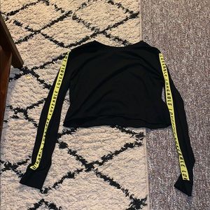 Black shirt with yellow lines on the sides